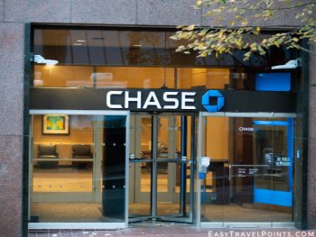 Chase bank office branch entrance in downtown with a logo on top.