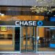 Chase bank office branch entrance in downtown with a logo on top.