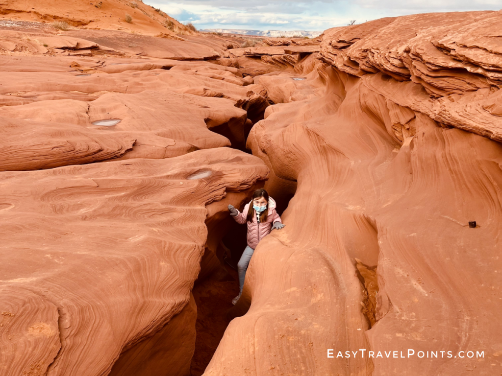 A little girl exiting lower antelope canyon