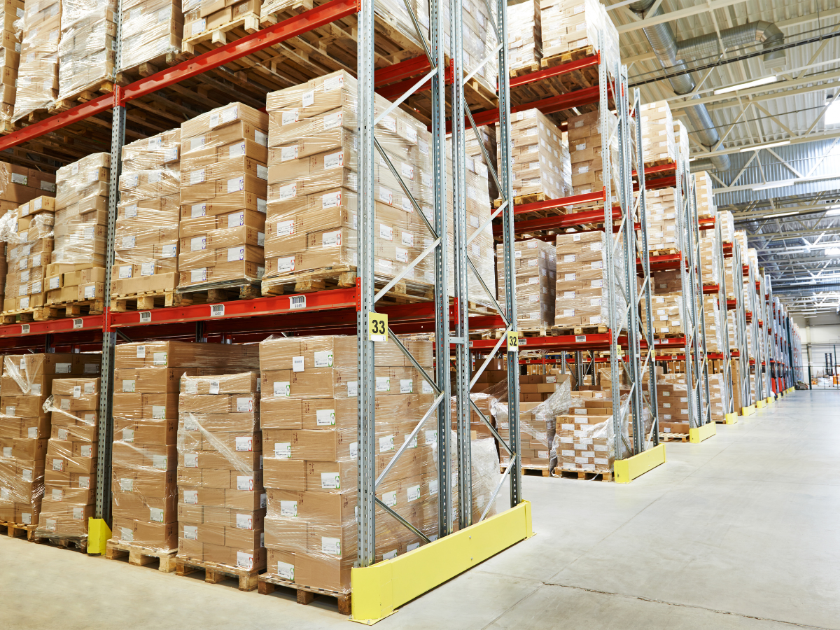 A large buying group warehouse filled with pallets and boxes